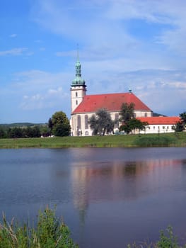           Monastery in Bilina in the Czech republic with lake