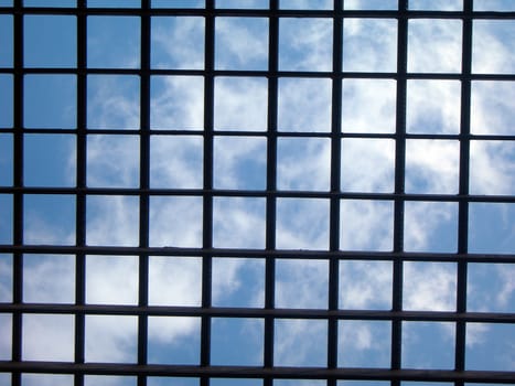        Blue sky behind the bars - grid texture