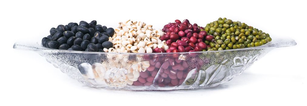 red beans, green beans and black beans on background