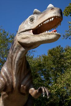 Aggressive T-Rex close-up on a blue sky