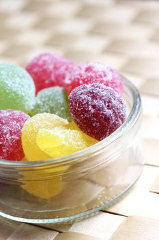 colorful fruit gums in a glass beverage