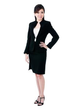 Full-length portrait of an attractive young Asian businesswoman over white background.