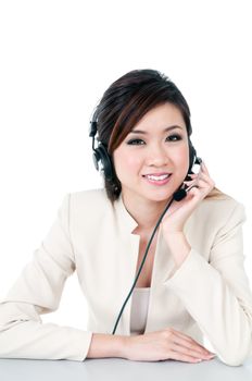 Portrait of a cute young businesswoman with headset over white background.