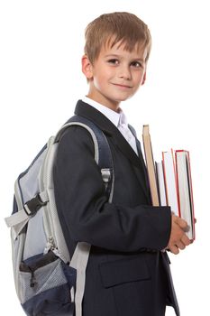 Boy holding books isolated on a white background