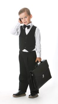 Boy holding a briefcase isolated on white background