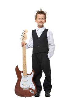 Boy holding a guitar isolated on a white background