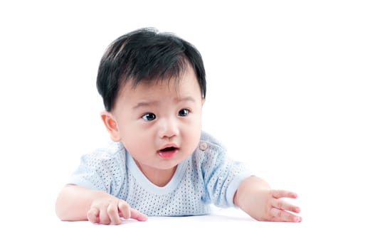 Portrait of an infant baby crawling over white background.