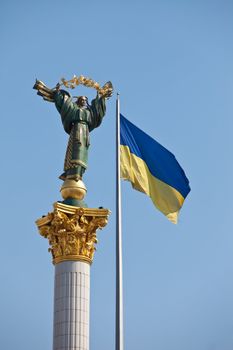 The Independence monument and ukrainian flag in Kiev. Downtown of a capital