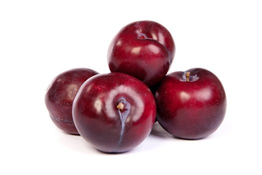 Group of plums isolated on a white background