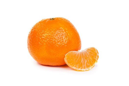 Ripe tangerines or mandarin with slice isolated on white background