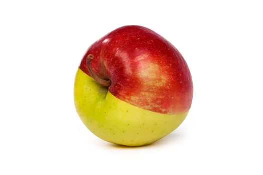 An apple made from half a red and half a green apple isolated on a white background