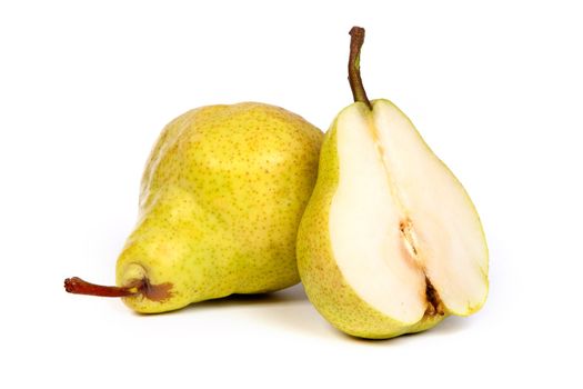 Whole peat and pear cuts in half isolated on a white background