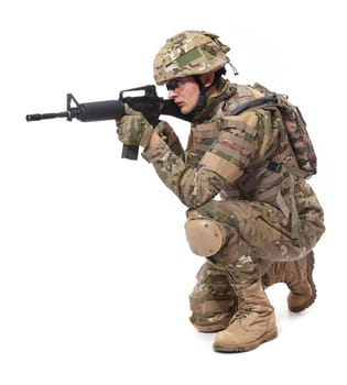 Modern soldier with rifle isolated on a white background