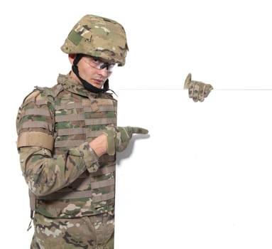 Modern soldier holding a poster isolarted on white