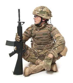 Modern soldier with rifle isolated on a white background
