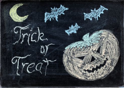 halloween drawing on chalkboard or blackboard with trick or treat