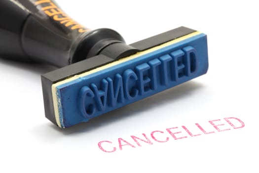 closeup of cancelled letter on rubber stamp isolated on white background