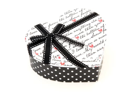 perspective of isolated black and white holiday gift box in heart shape