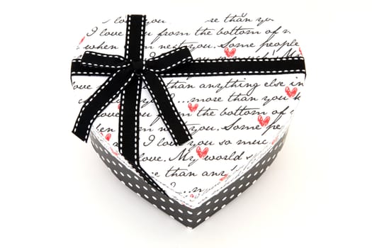 isolated black and white holiday gift box in heart shape