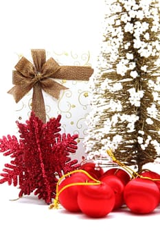 white holiday box with christmas tree and ornament