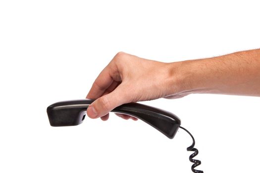 Hand holding an old black telephone tube isolated on white background