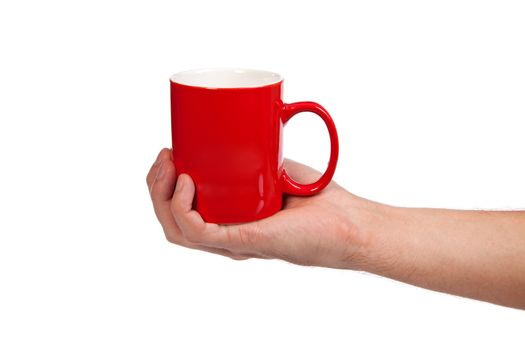 Male hand is holding a red cup isolated on a white background