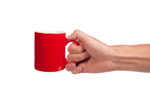 Male hand is holding a red cup isolated on a white background