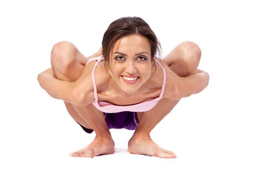 Practicing Yoga. Young woman isolated on white background