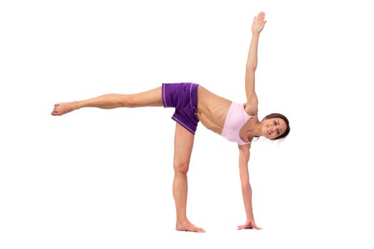 Practicing Yoga. Young woman isolated on white background