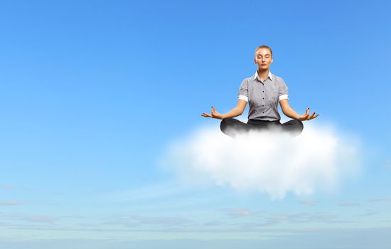 Businesswoman meditating sitting on the white cloud