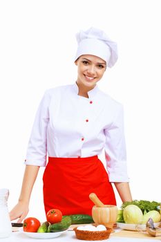 Young cook preparing food wearing a red apron