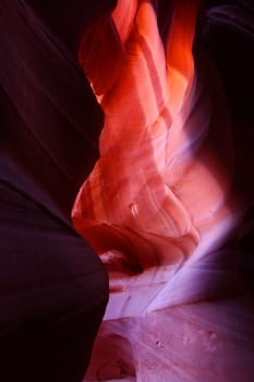 Patches of light illuminate the beautifully colored rock walls of Antelope Canyon in Arizona.
