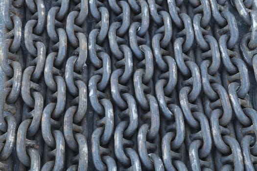 used heavy iron chain on the ground