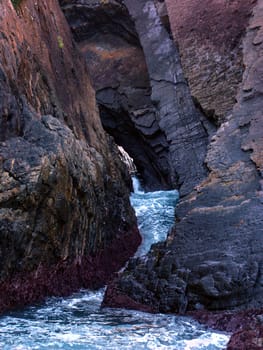 Waves crash through Seal Rocks Area of Booti Booti National Park in Australia.