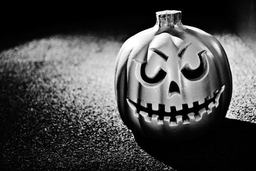 Black and white photo of a pumpkin with dramatic lighting