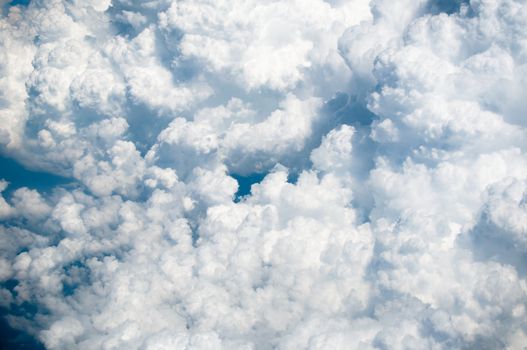 Image of blue sky with white clouds from above