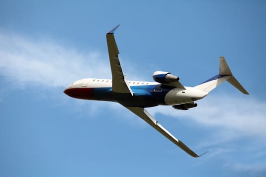 business jet in the blue sky