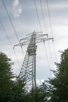 high voltage power electricity pylons under sky