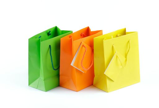 Green, Orange and Yellow Shopping Bags isolated on white background