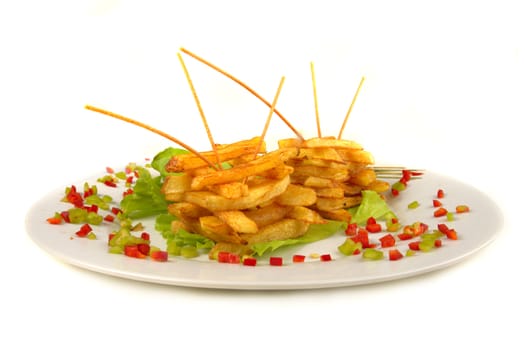 Serving of French fries on a white background                          