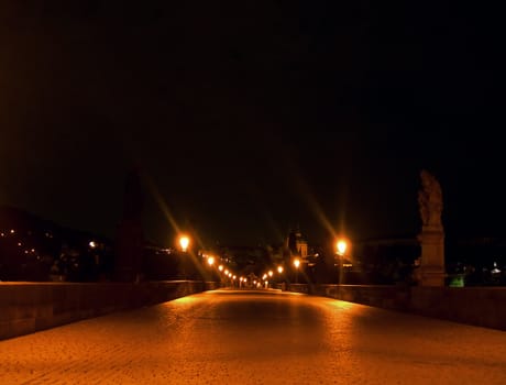     Charles bridge in Prague in the night with lanterns      