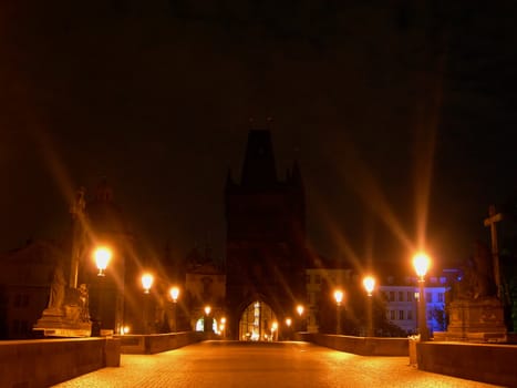         Charles bridge in Prague with lantern lights