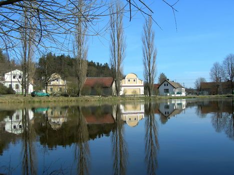           reflection of village in the river