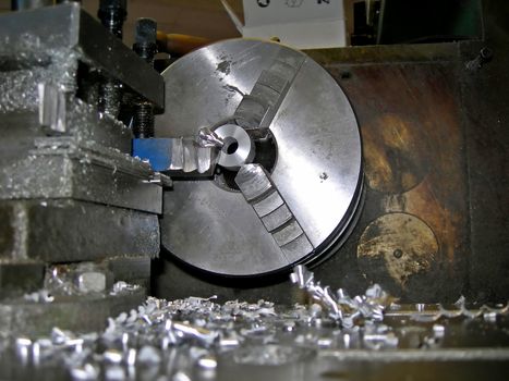  Detail of lathe processing a metal bar      