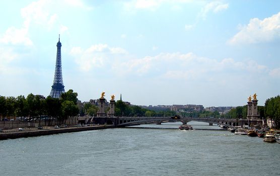 Viex from the river Seine at Bridge of Alexander and a famous Eiffel tower in Paris