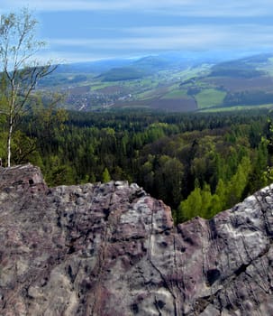 View from a steep rock at a small town and a natural scenery