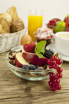 healthx breakfast with flakes and fruits in morning on wooden table