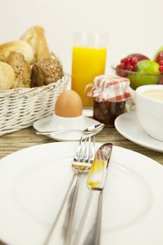 traditional french breakfast in morning on wooden background