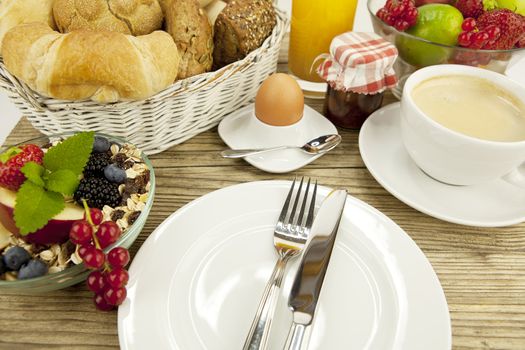 traditional french breakfast in morning on wooden background