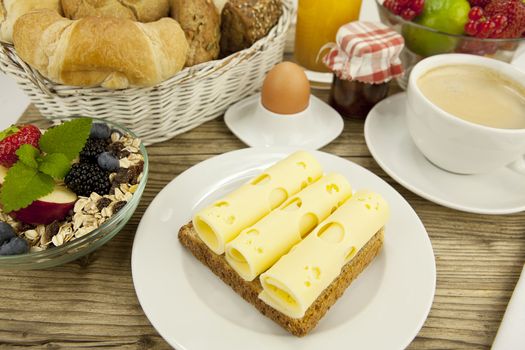 breakfast in morning with fruits  cheese toast coffee on wooden table